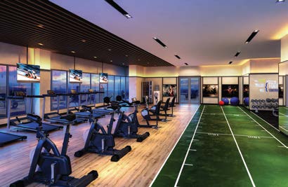 Modern gymnasium with fitness equipment at Padang Residences